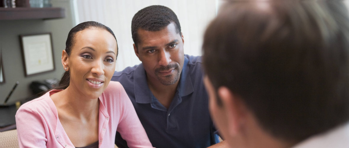 elderly couple listening to a therapist